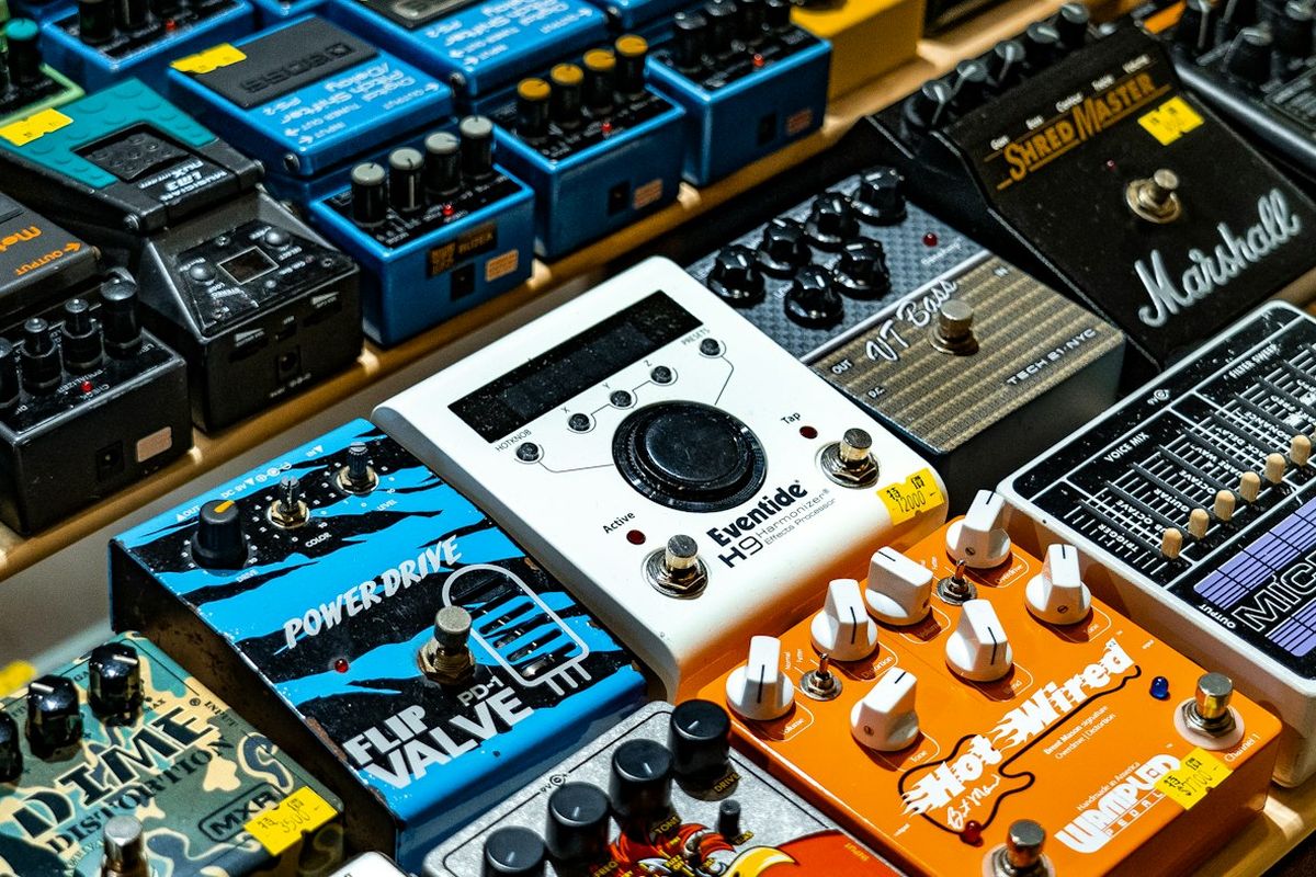 A wall of colourful guitar effects pedals on display
